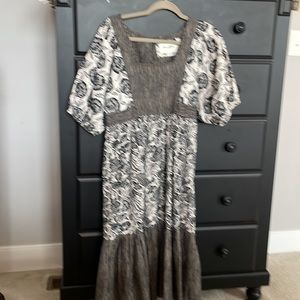 Mid calf floral black and mixed print floral and stripe Anthropologie dress.